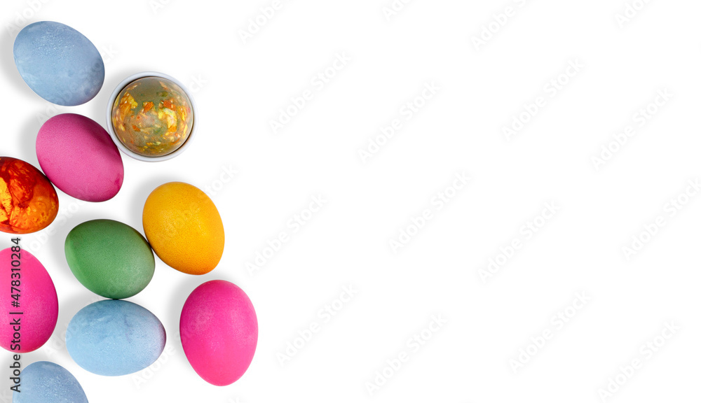 Easter colored eggs on white, mock up for a banner, top view, flat lay, copy space