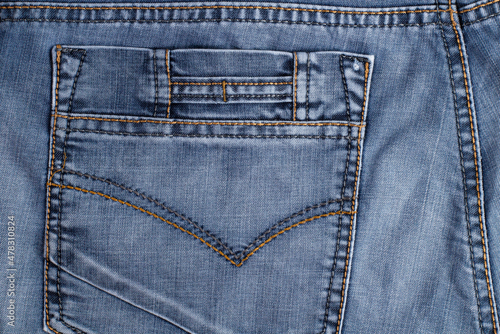 Back pocket of jeans close-up, place for text Back pocket of jeans close-up, place for text