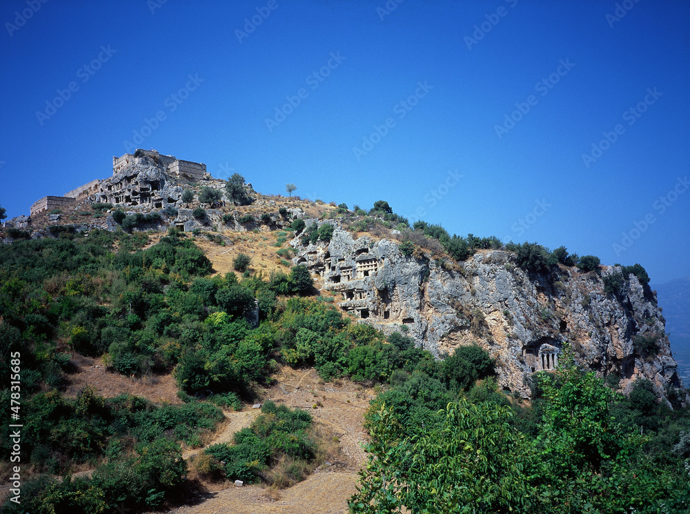 houses and temples carved in the rocks in Kayakoy, Turkey