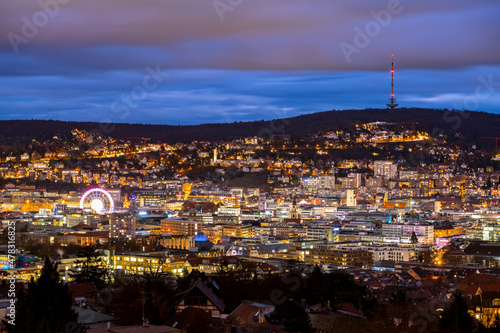 Stuttgart Cauldron nighttime panorama. Illuminated town at winter evening blue hour with hundreds of lights. Capital and largest city of the German state of Baden-Württemberg. Cradle of automobile.