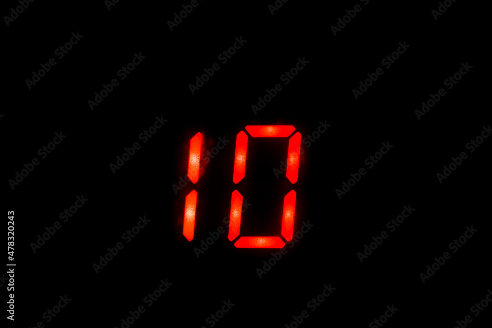 Old digital clock red number on black background Old digital clock red number on black background
