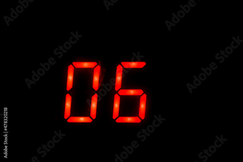 Old digital clock red number on black background