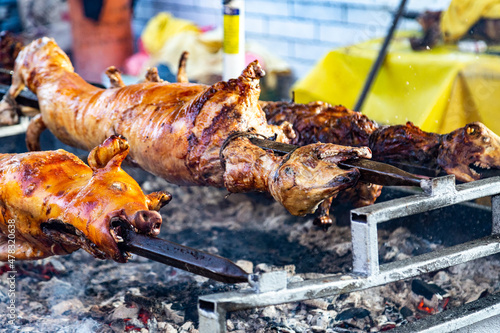 Whole pig and roasting on a spit