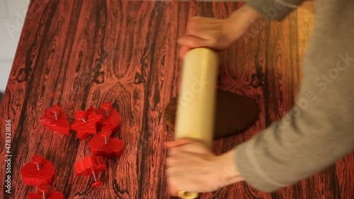 Making cookies. Molding cookie dough. Female hands making cookies on table in kitchen (Soviet Union old flat)