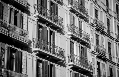 Balconies on apartment building facades in Barcelona, Spain. Black and white.