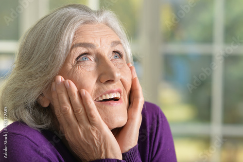 Portrait of happy senior woman in posing