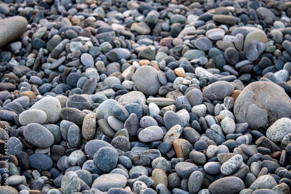 Pebble beach on the Black Sea coast in Pitsunda. Marble pebble beach. Resort beach with the purest pebbles. Pebble beach on the Black Sea coast in Pitsunda. Marble pebble beach. Resort beach with the purest pebbles.