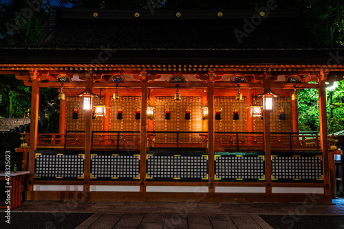 Wallpaper Mural A Japanese shrine at the Fushimi Inari Taisha Shinto shrine in Kyoto Japan at night with its lanterns turned on. Torontodigital.ca