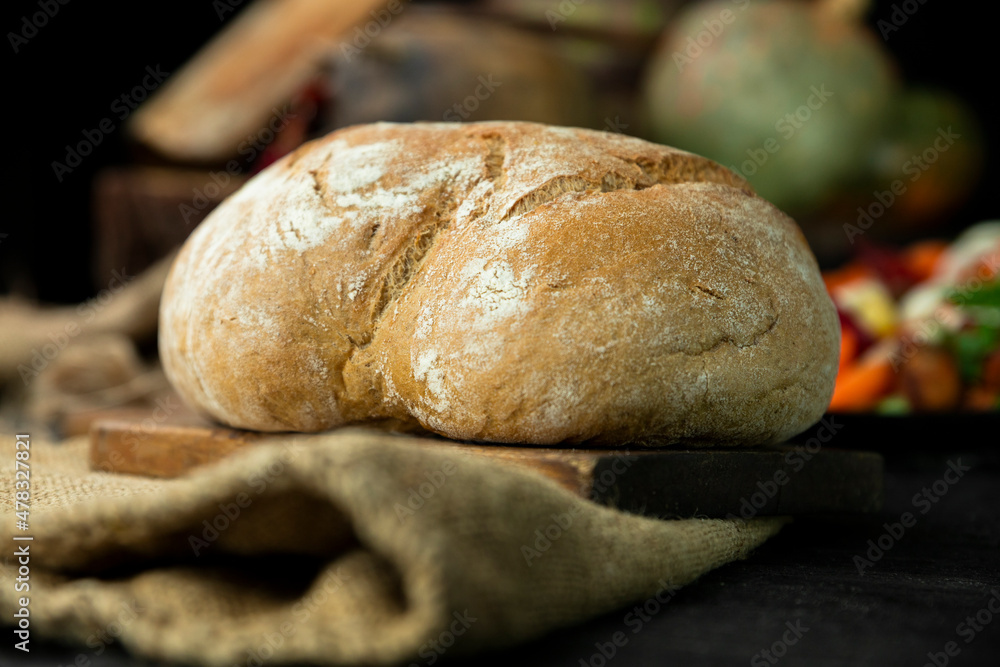 Loaf of bread in the rustic kitchen Loaf of bread in the rustic kitchen
