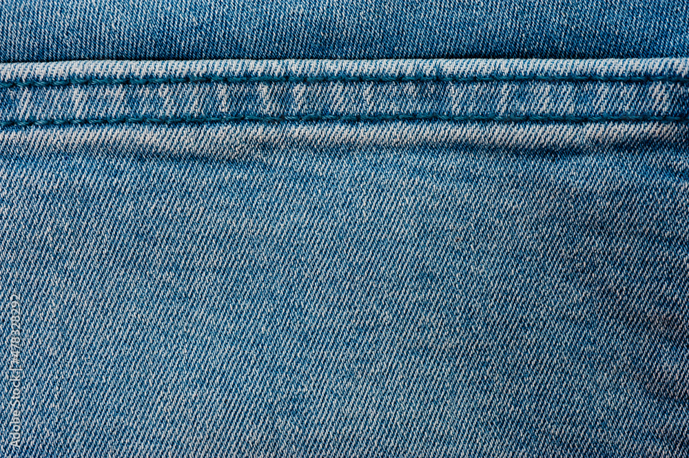 Close up of blue denim texture with sewing. Close up of blue denim texture with sewing.