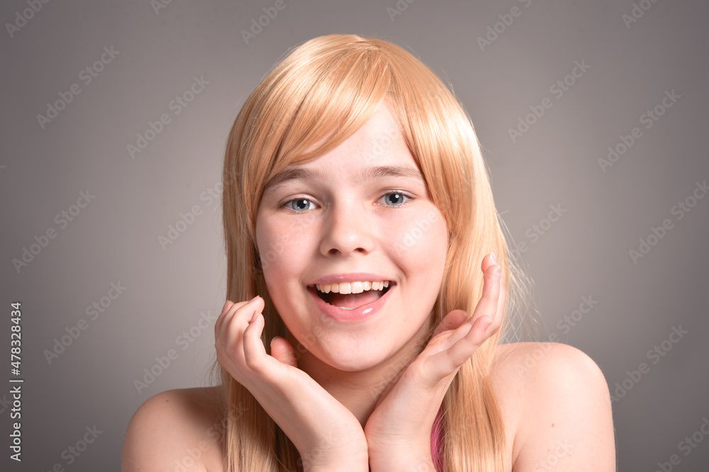 Fototapeta premium Portrait of blonde girl posing in studio