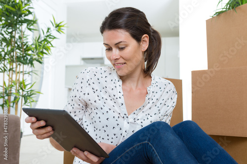 woman checking her account during moving