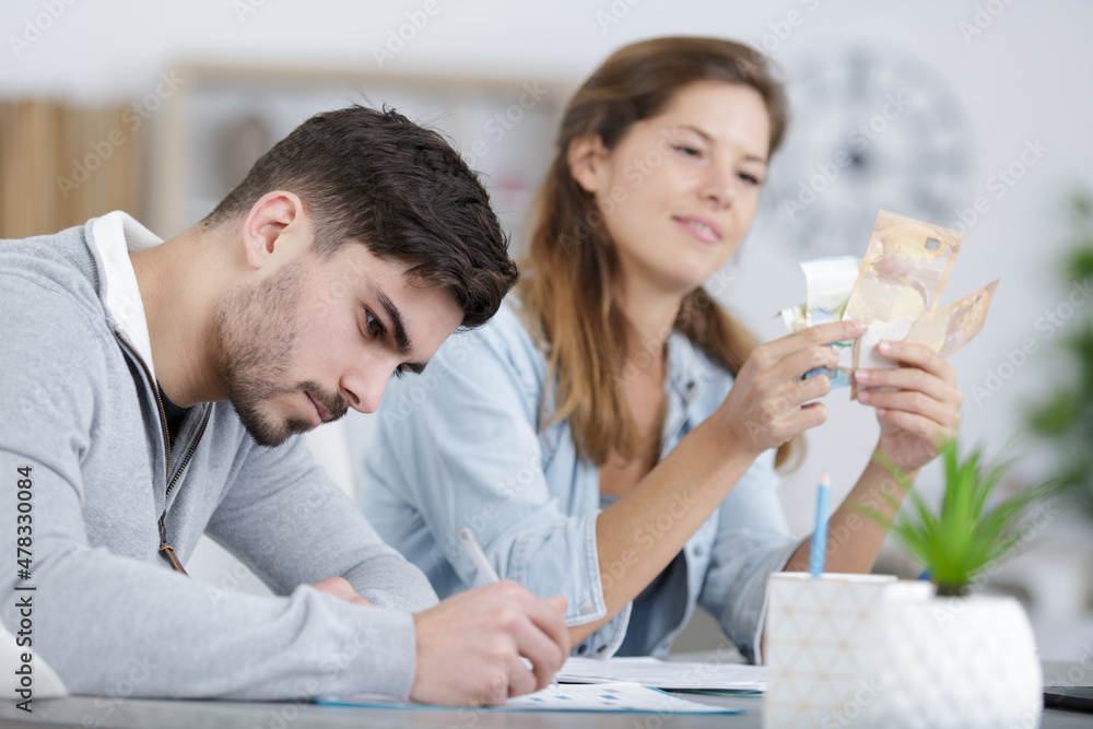 couple at cafe reading bank contract document couple at cafe reading bank contract document