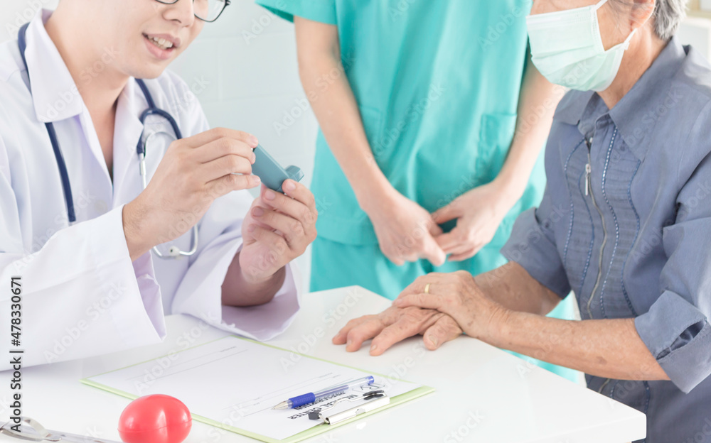 asian doctor explain about how to use inhaler medicine, asthma clinic, elderly disease, he holding inhaler medicine with hand asian doctor explain about how to use inhaler medicine, asthma clinic, elderly disease, he holding inhaler medicine with hand