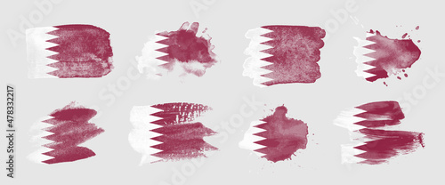 Painted flag of Qatar in various brushstroke styles.