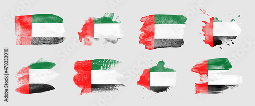 Painted flag of the United Arab Emirates in various brushstroke styles.