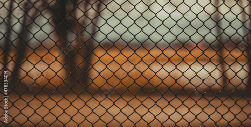 A fence made of a metal mesh close-up. Abstract background.