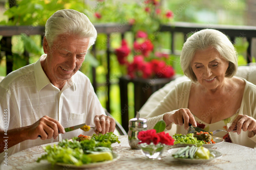 Portrait of happy senior couple having diner Portrait of happy senior couple having diner