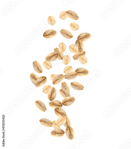 Dry uncooked oatmeal falling on white background