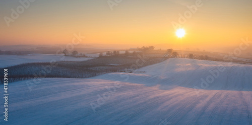 Winter scenery of Kociewie fields at sunset. Poland