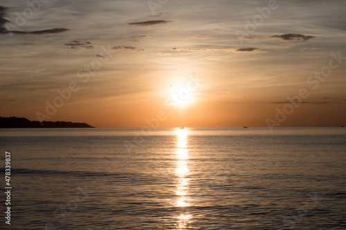 Beautiful sunset with a boat in the middle