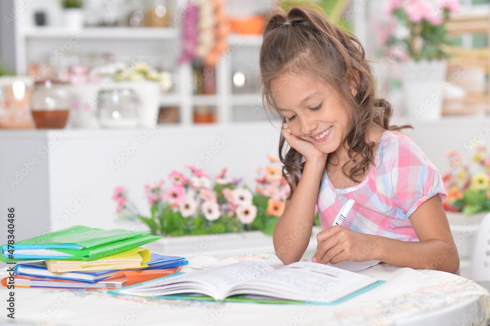 portrait of happy schoolgirl studying at home portrait of happy schoolgirl studying at home