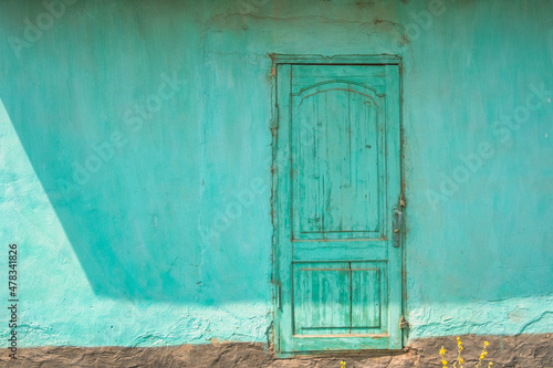 Old fringed door in a rural area, Kyrgyztan © Frankix