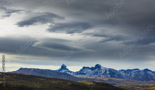 Jagged mountains in the mountain range Sierra Baguales under dark threatening sky, Patagonia, Chile