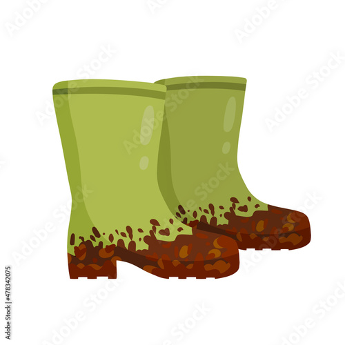 Rubber muddy boot with dirt. Waterproof rain shoes for fishing and gardening.