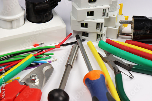 Electrician's tools for assembling electrical panels are located on the schematic diagram.