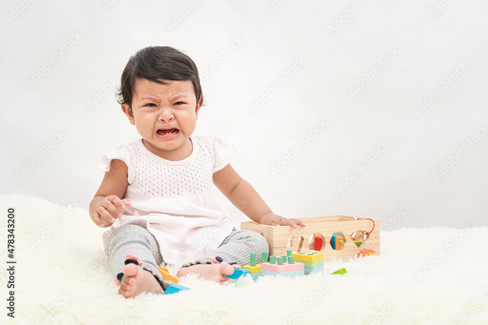 Baby girl is crying, dissatisfied, needs the love of her parents. Baby girl is crying, dissatisfied, needs the love of her parents.