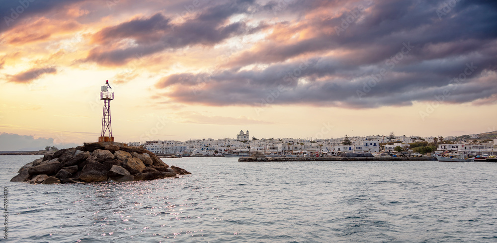 Paros island Greece Naousa village Cyclades. Whitewashed buildings, colorful sunset over harbor