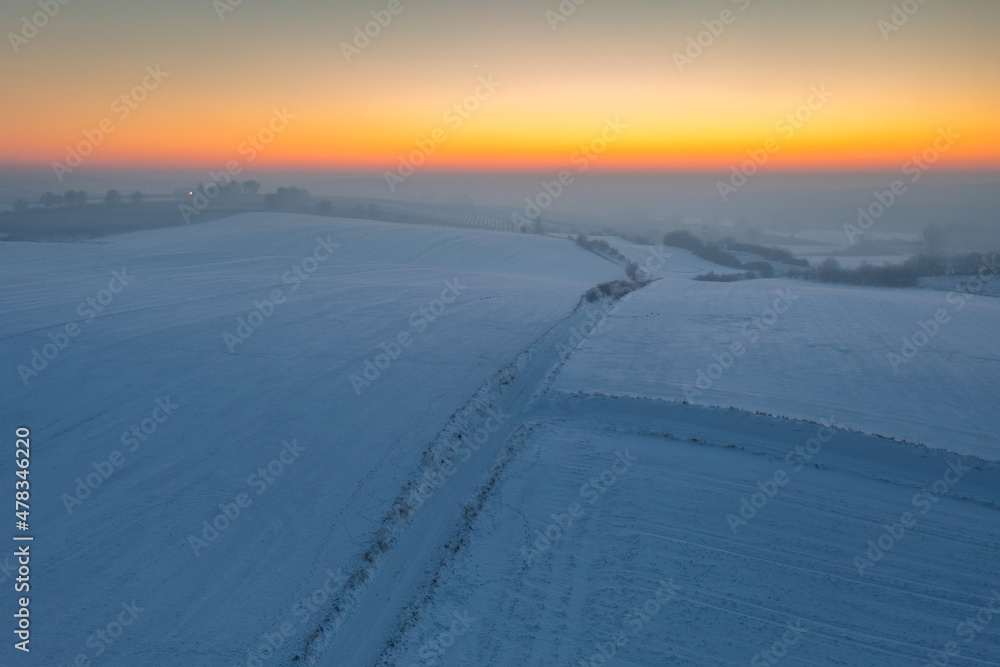Winter scenery of Kociewie fields at sunset. Poland