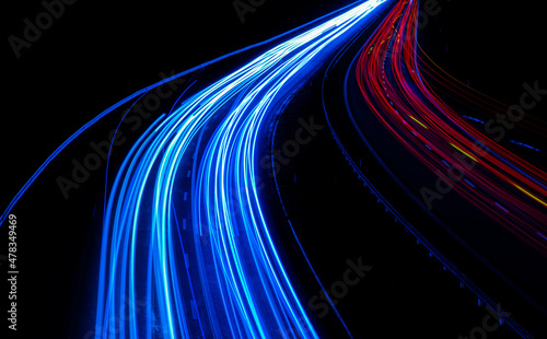 Night road lights. Lights of moving cars at night. long exposure red, blue, green, orange.