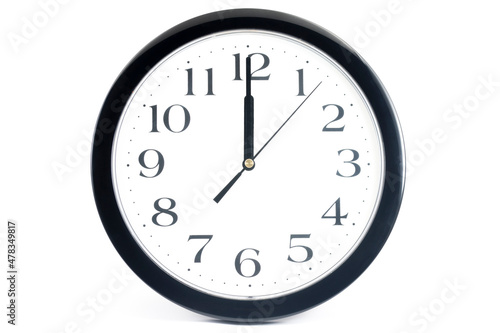 Black classic clock on isolated white background.