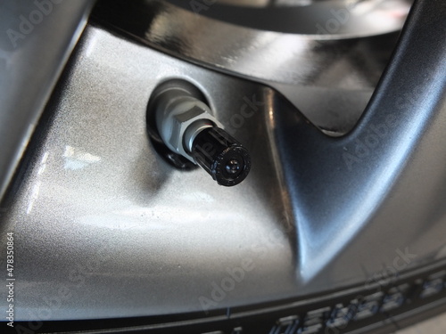 Aluminum wheel with  car tire nippel. The tire pressure sensor 