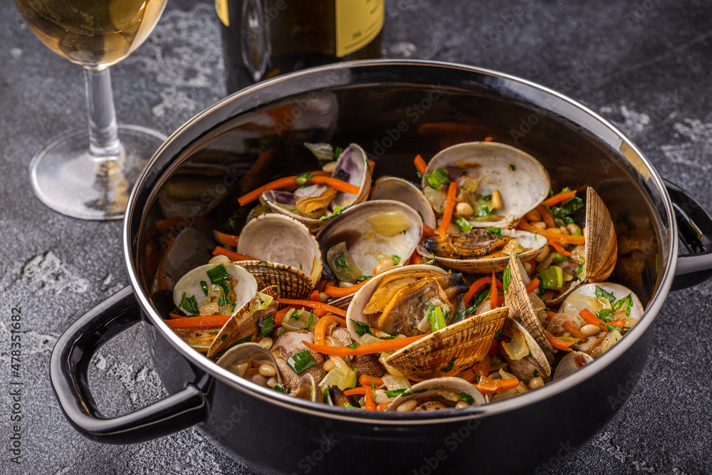 Shells vongole venus clams with vegetables and herbs Shells vongole venus clams with vegetables and herbs