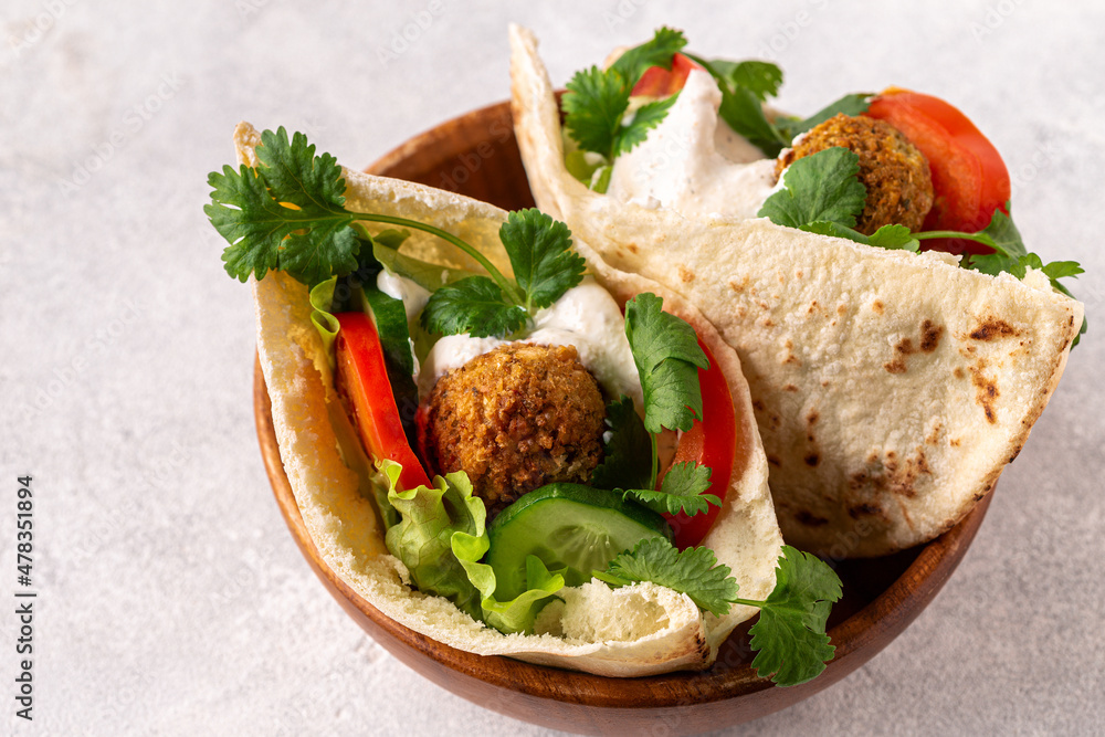 Falafel and fresh vegetables in pita bread Falafel and fresh vegetables in pita bread