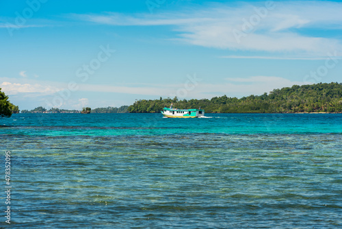 Islanders and tourists travel from island to island by slow boat in the Togian Islands. The ferry from Ampana connects the mainland with the main towns of Bomba to Wakai.  © ksl
