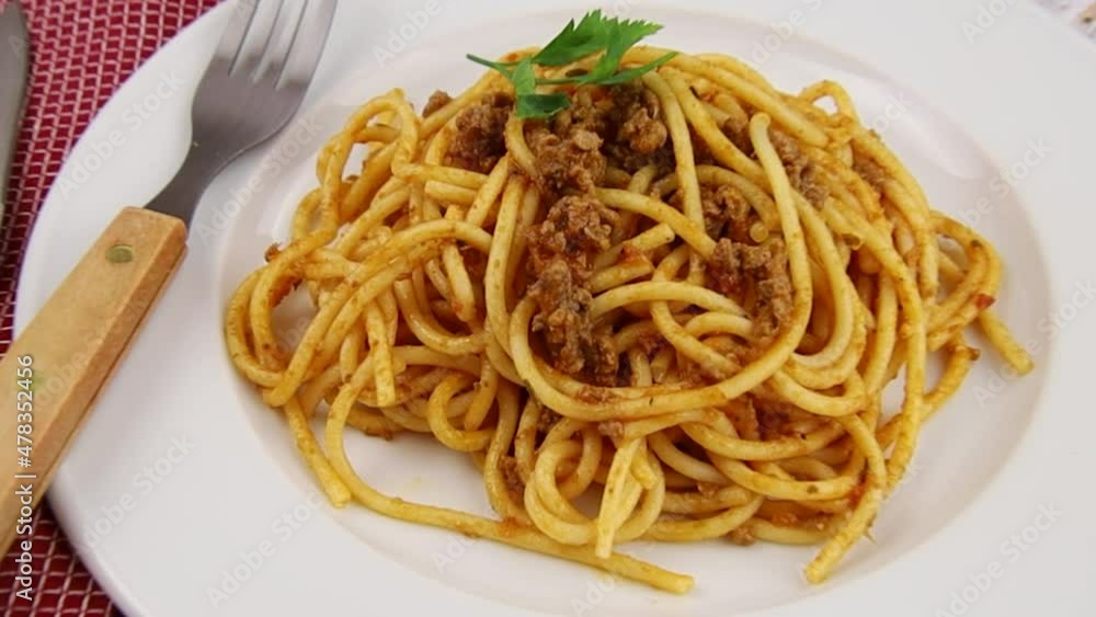 plate of spaghetti bolognese sauce on a table plate of spaghetti bolognese sauce on a table