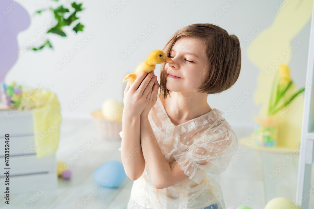 Portrait of happy Little girl who plays and communicates with duckling. Easter decorations. Portrait of happy Little girl who plays and communicates with duckling. Easter decorations.