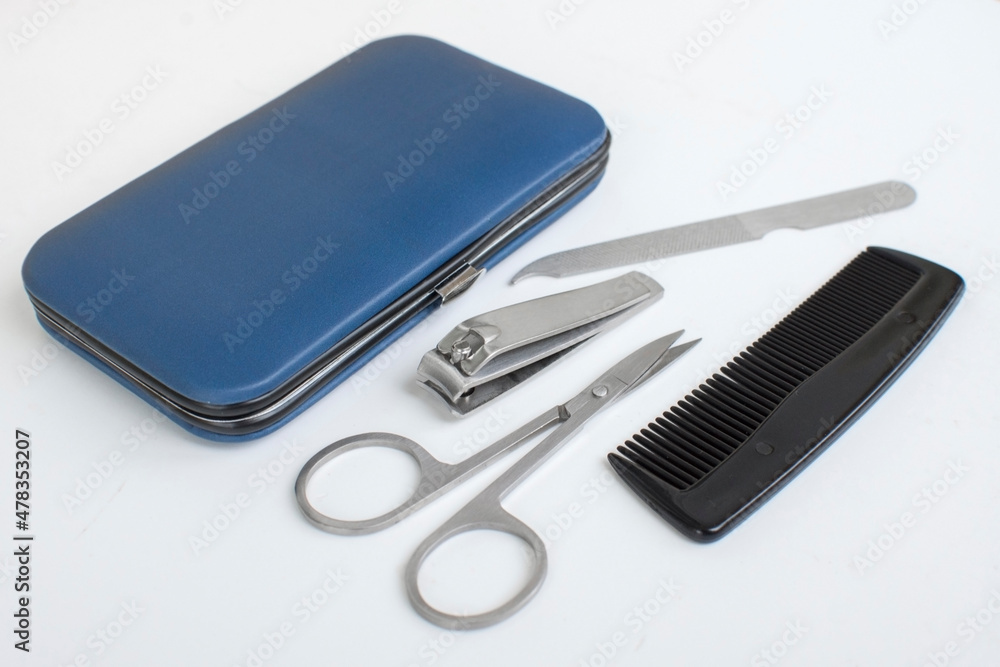 Set of tools for man's hand nail care, manicure equipment. Scissors, nail file, little hairbrush and nail clipper. Set of tools for man's hand nail care, manicure equipment. Scissors, nail file, little hairbrush and nail clipper.