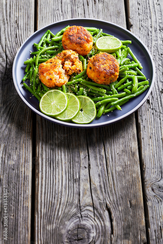 Prawn and Crab Cakes on a plate with green beans