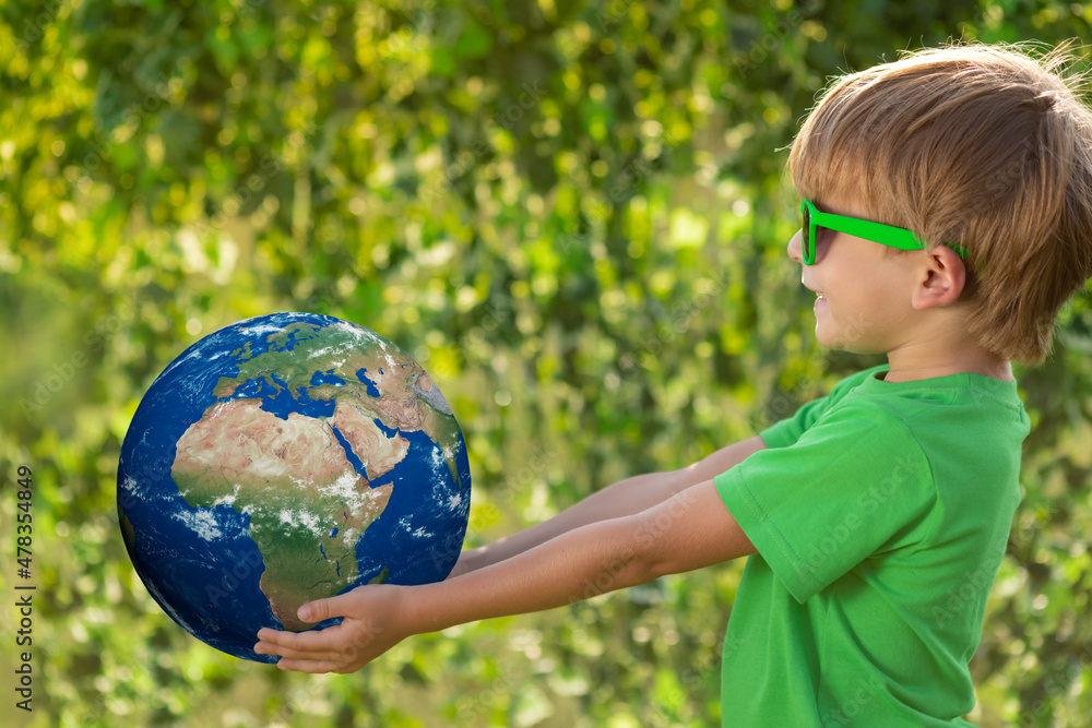 Child holding Earth planet in hands. Elements of this image furnished by NASA Child holding Earth planet in hands. Elements of this image furnished by NASA
