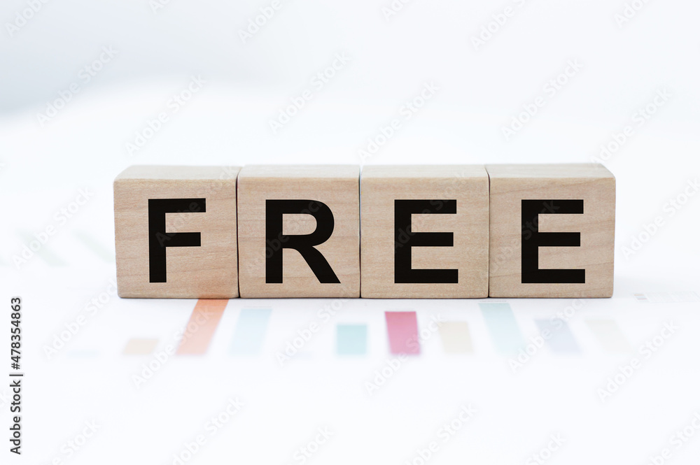 the wooden cubes with the word free. Business promotion, free of charge, free trial or delivery concept. the wooden cubes with the word free. Business promotion, free of charge, free trial or delivery concept.