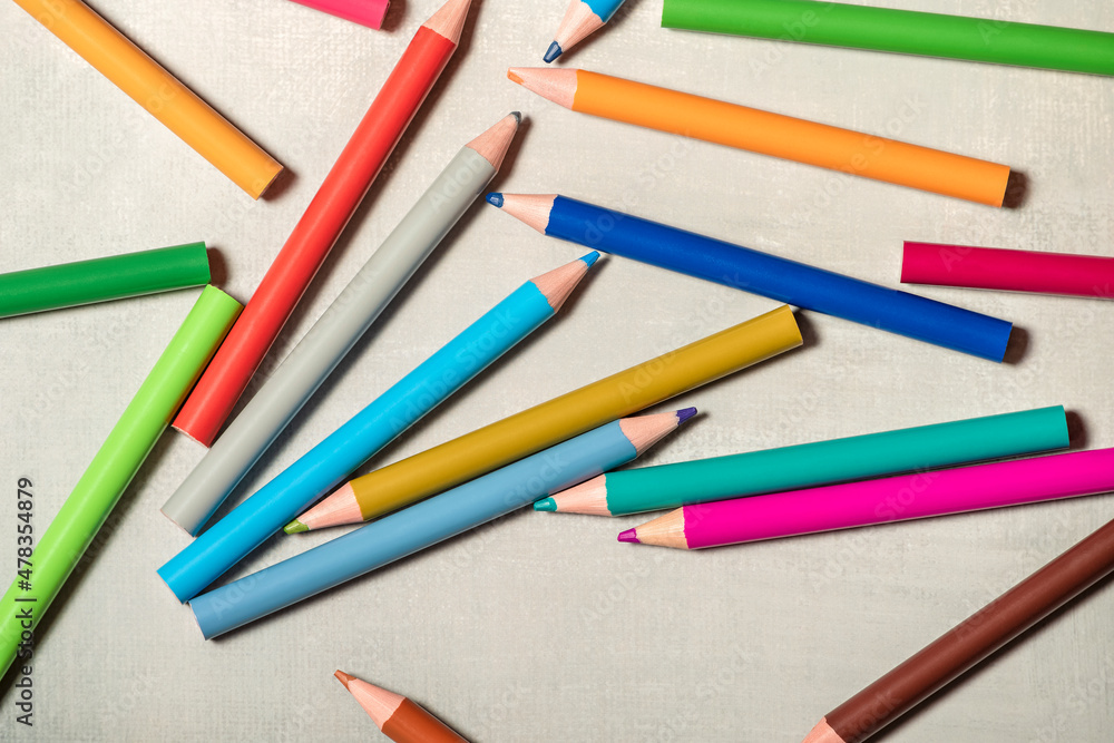 School pencils are scattered on gray background. School pencils are scattered on gray background.