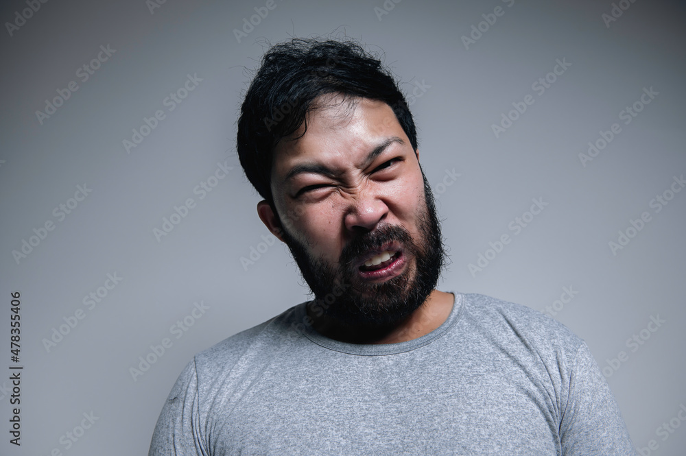 Fototapeta premium Asian handsome man angry on white background,Portrait of young Stress male concept
