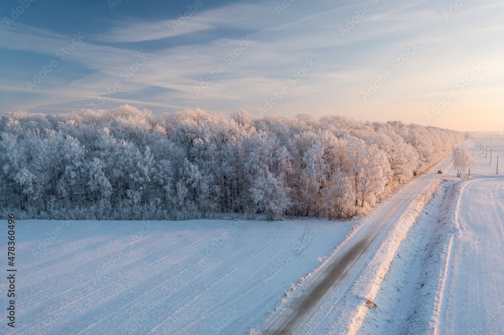 Frozen land: road through the countryside Frozen land: road through the countryside