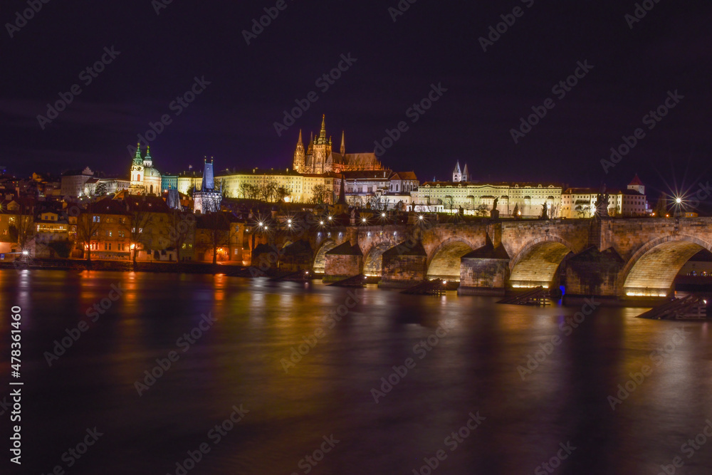 Castle at night, river and city landscape
