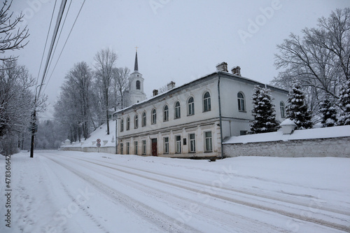 Svyatogorsky Monastery in Pushkin hills, Russia and snow covered trees